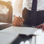 Lawyer in a high-end office reviewing revenue reports and client growth strategies