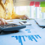 A lawyer sitting at a modern desk reviewing digital lead reports and evaluating a paid legal lead generation service.