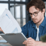 A lawyer reviewing lead generation fees and marketing ROI strategies on a digital dashboard.