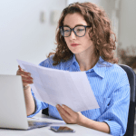 A lawyer reviewing lead generation reports from multiple legal lead providers on a laptop.