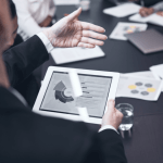 Law firm team reviewing digital marketing dashboard to evaluate purchased legal leads
