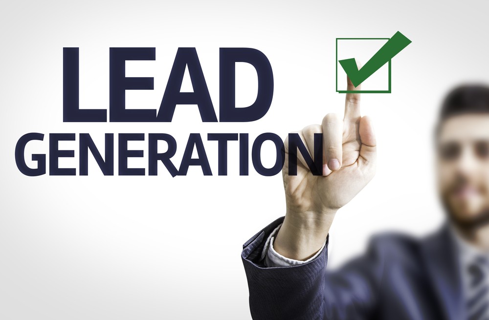 Businessman pointing at a checkmark with the words Lead Generation