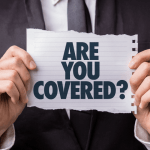 Businessman holding a sign that reads “Are You Covered?”
