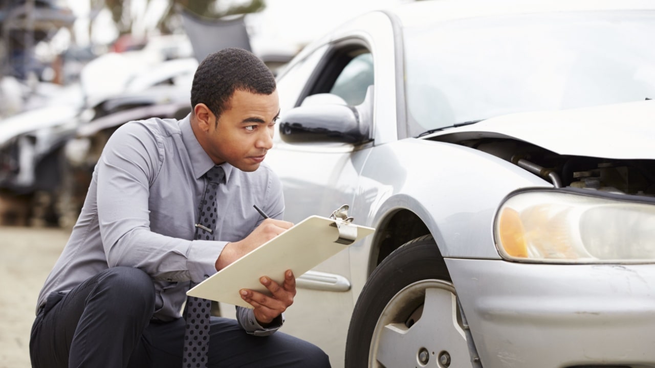 Insurance adjuster inspects damaged car — how do I write a demand letter for a car accident?