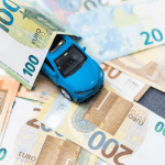 Toy car on top of euro banknotes — how much do auto leads cost?