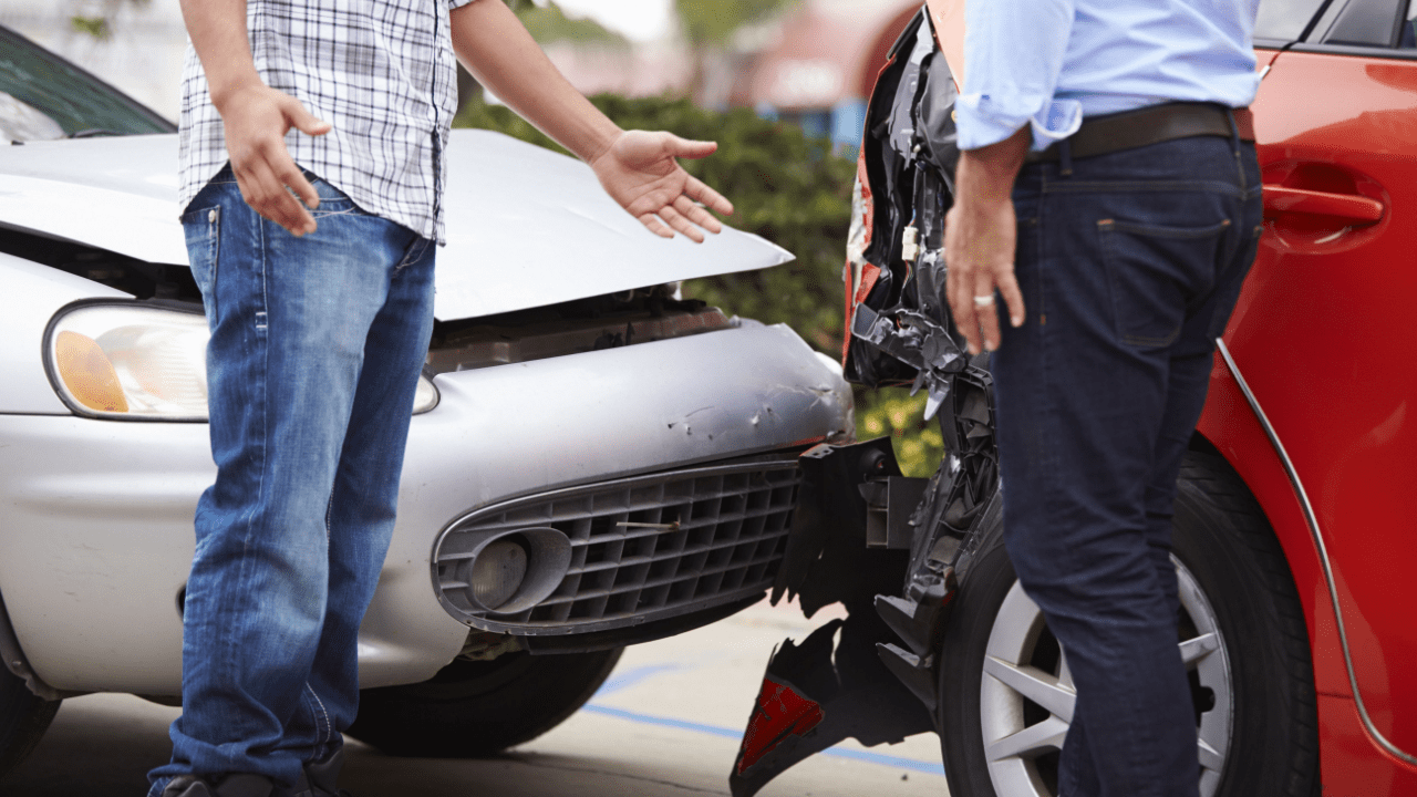 Two drivers discussing rear-end collision damage – what is the most you can get from a car accident