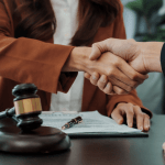Bankruptcy attorney shaking hands with new client after successful consultation, demonstrating effective strategies on how to find bankruptcy clients