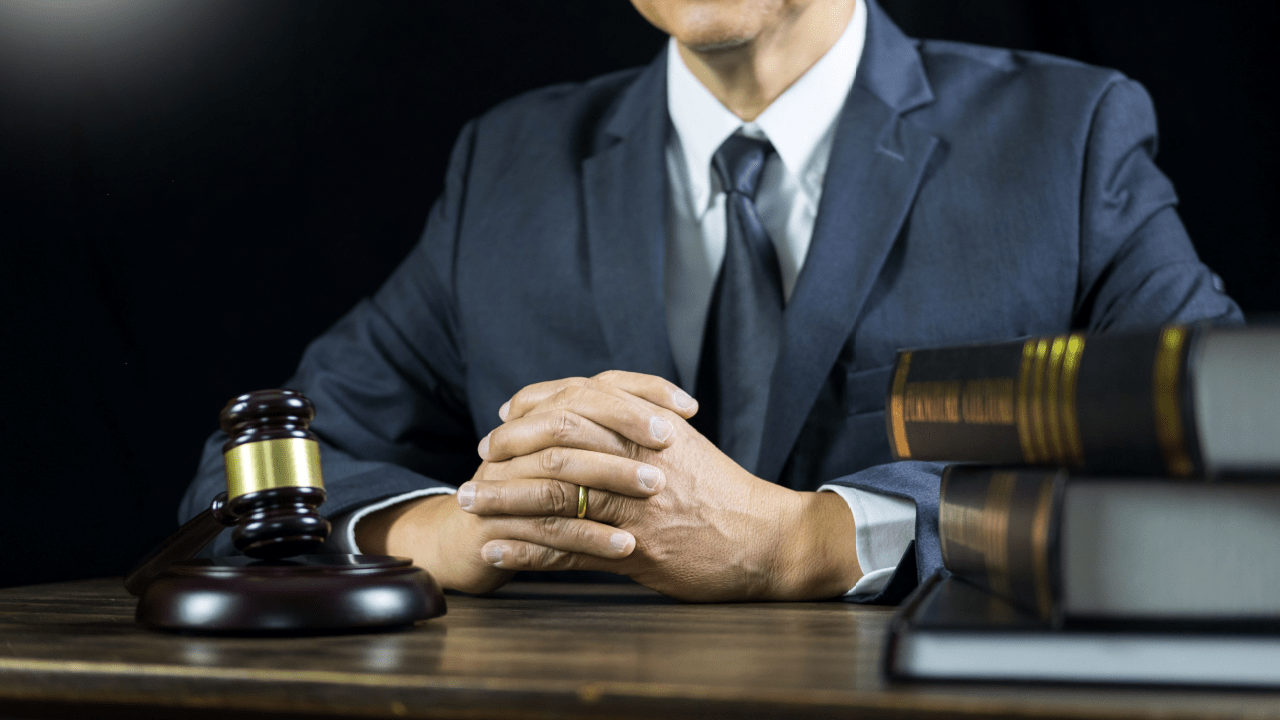 Professional auto accident attorney at desk with gavel and law books ready to convert exclusive auto accident leads