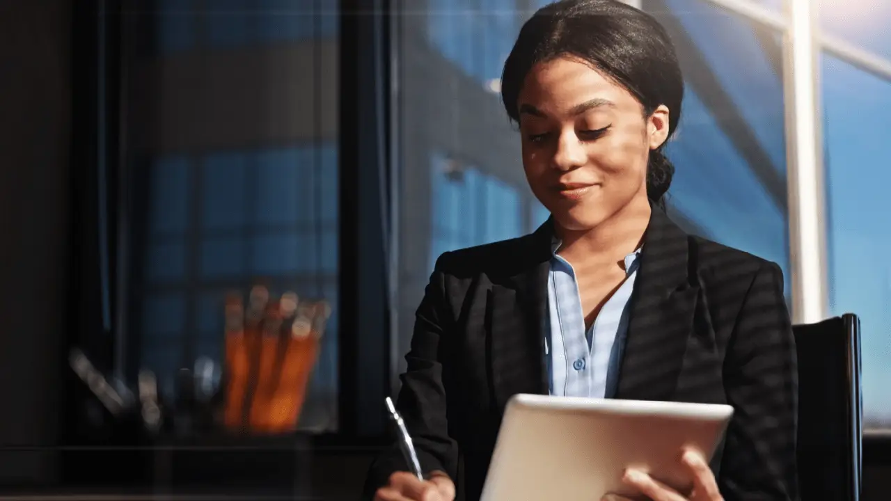 Attorney reviewing digital analytics on tablet learning how to improve law firm SEO in modern office setting