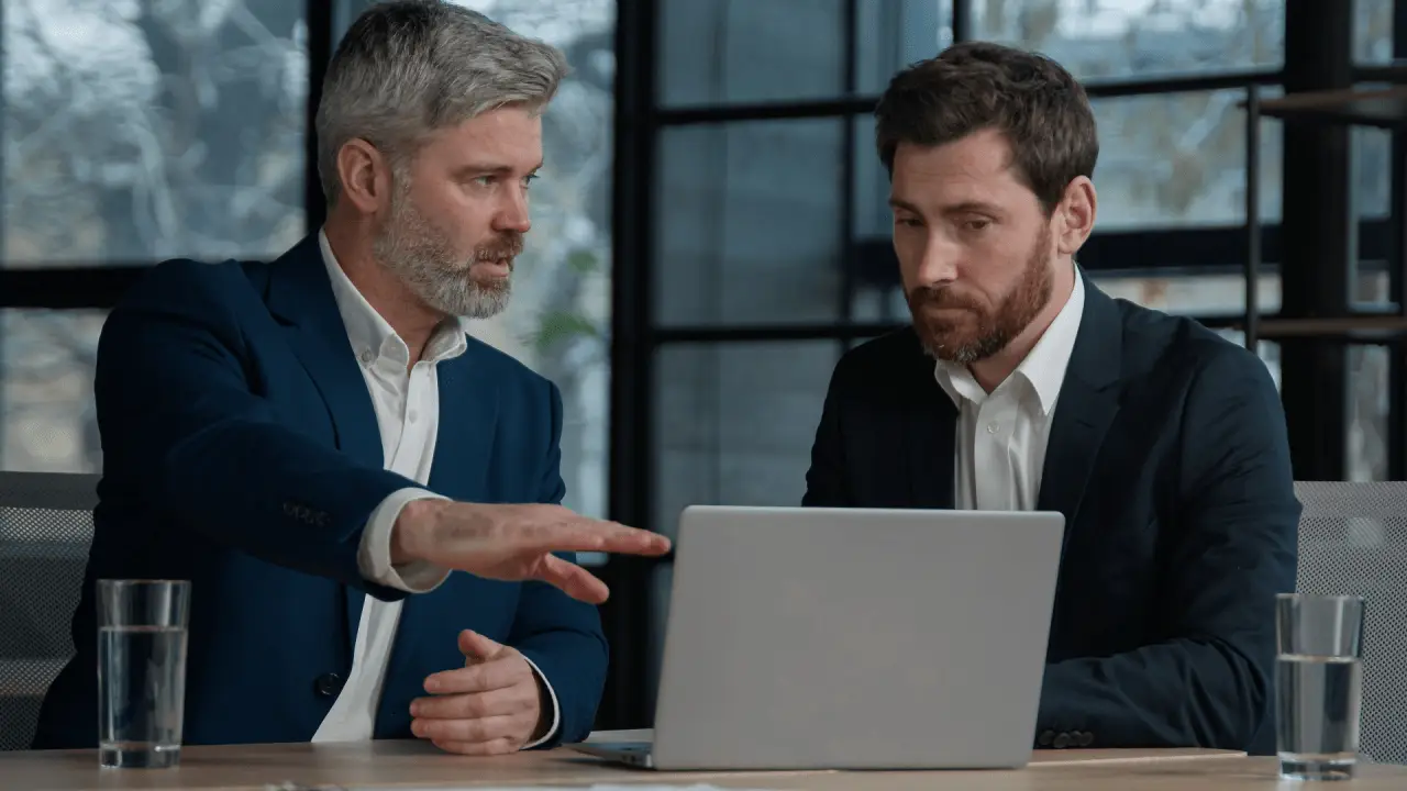 Two attorneys discussing how to pivot SEO strategy law firm slow results during strategic consultation meeting