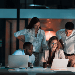 Business team learning how to vet a law firm SEO agency effectively by reviewing proposals and credentials on laptops in modern office