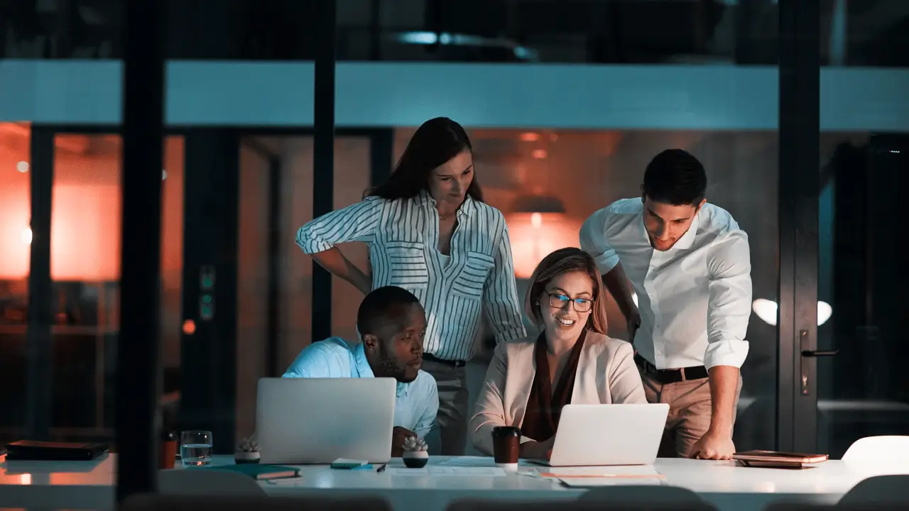 Business team learning how to vet a law firm SEO agency effectively by reviewing proposals and credentials on laptops in modern office