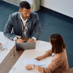 Business professionals evaluating best leads for bankruptcy during consultation meeting in modern office