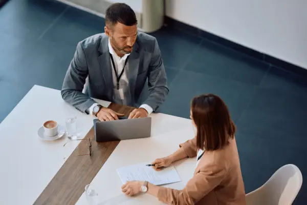 Business professionals evaluating best leads for bankruptcy during consultation meeting in modern office