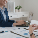 Legal professional using laptop to learn how to build local citations for law firm SEO during client consultation