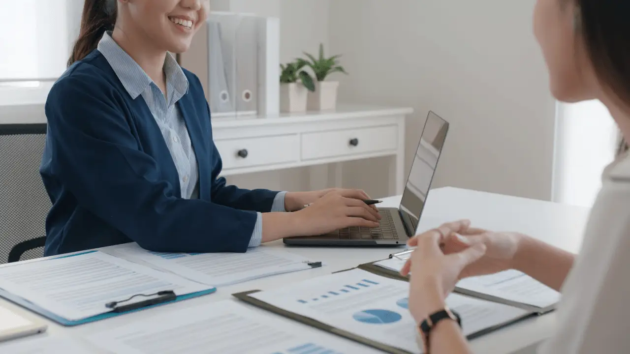 Legal professional using laptop to learn how to build local citations for law firm SEO during client consultation