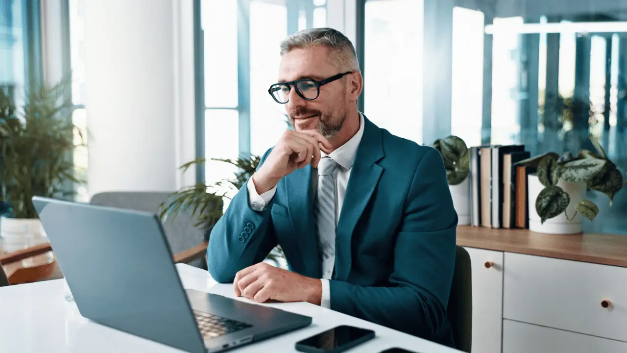 Professional attorney researching what is geotagging and does it help law firm SEO on laptop in modern office