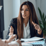 Business professional conducting bankruptcy lead pricing comparison discussion with client in modern office