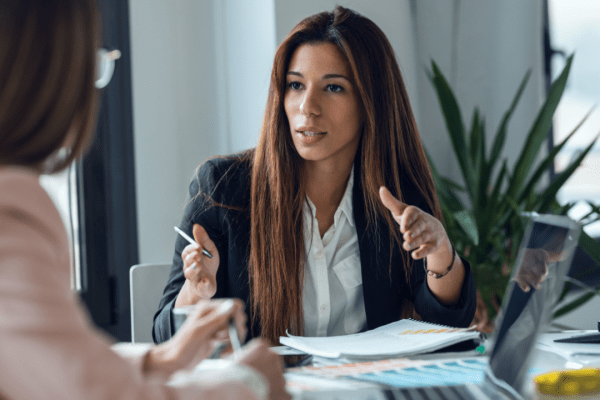 Business professional conducting bankruptcy lead pricing comparison discussion with client in modern office