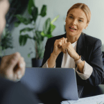 Business consultant advising attorney on how to generate bankruptcy attorney leads in professional office setting