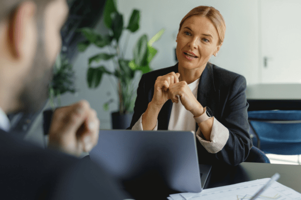 Business consultant advising attorney on how to generate bankruptcy attorney leads in professional office setting