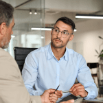 Professional discussing how to get bankruptcy leads in modern office setting