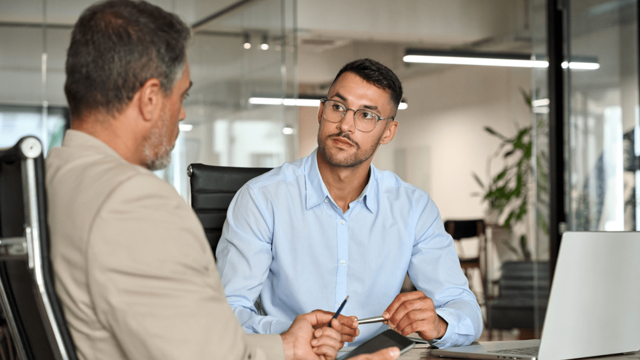 Professional discussing how to get bankruptcy leads in modern office setting