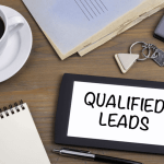 How SEO generates legal leads displayed on tablet with coffee and calculator showing qualified legal client acquisition