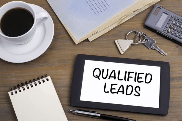 How SEO generates legal leads displayed on tablet with coffee and calculator showing qualified legal client acquisition