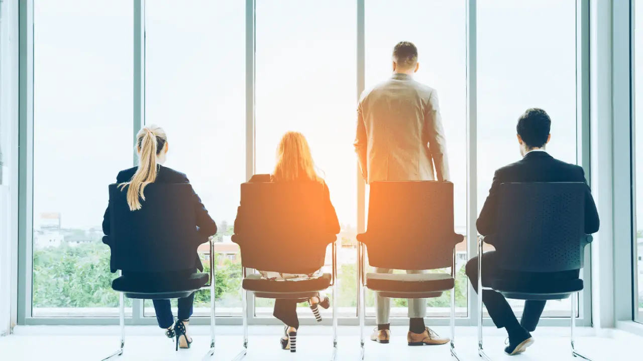 Law firm growth through SEO concept with business professionals looking toward future opportunities through office windows