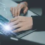 Practice area keyword intent research with professional typing on laptop showing digital analytics interface