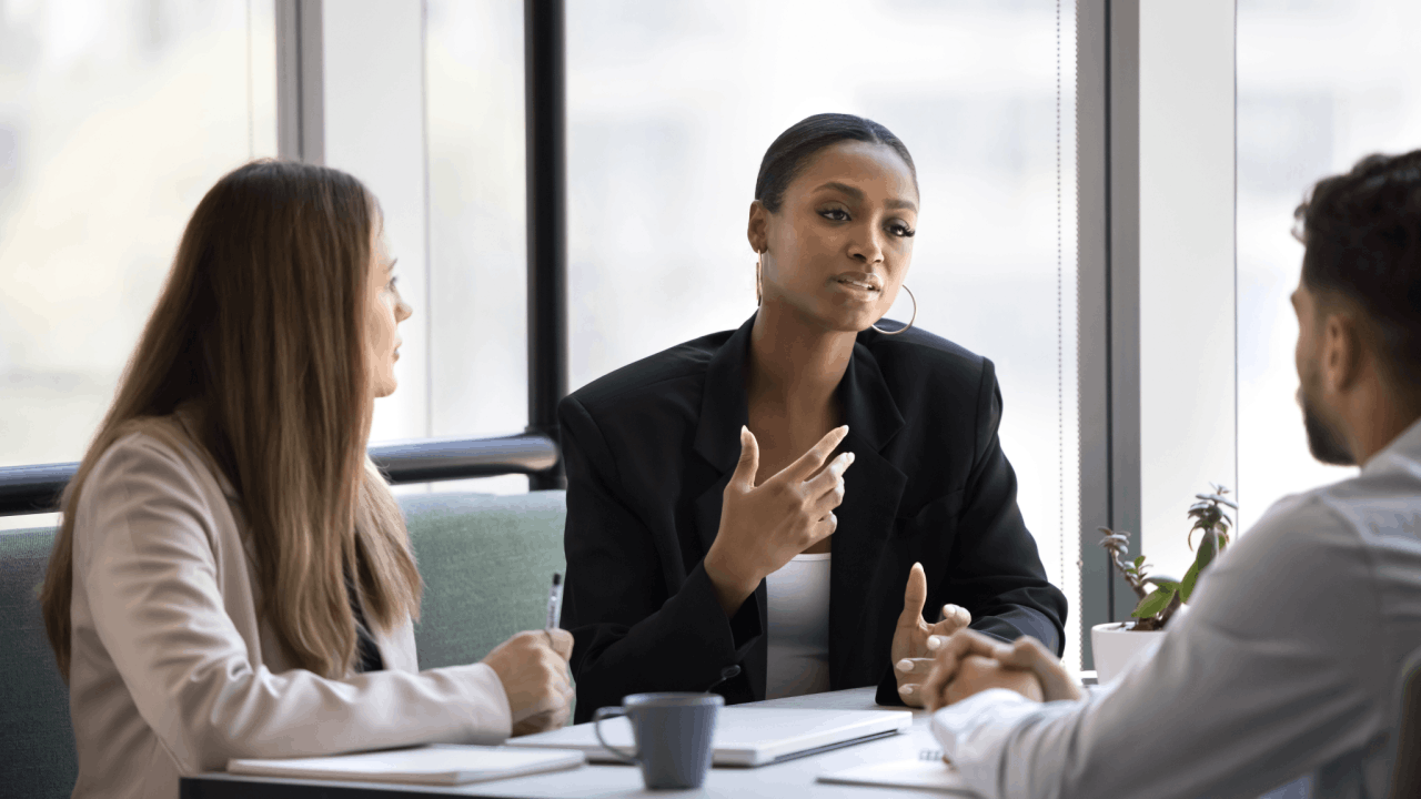 Practice area SEO leads consultation with attorney and clients discussing legal marketing strategies