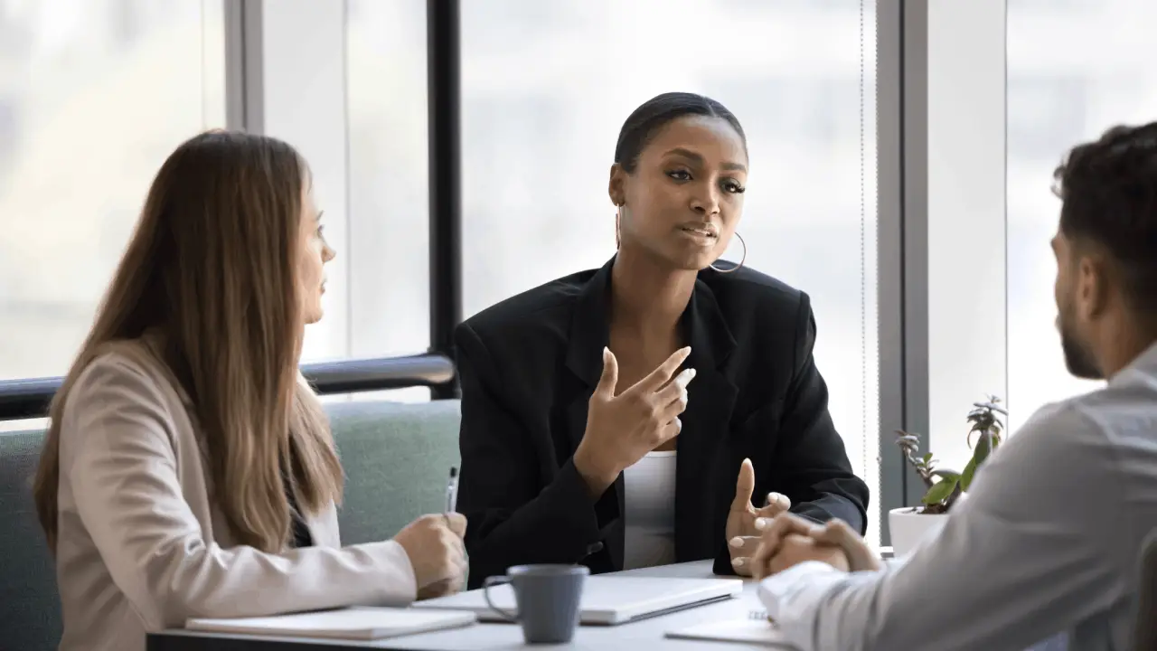 Practice area SEO leads consultation with attorney and clients discussing legal marketing strategies