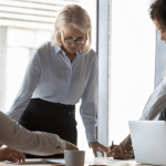 Attorneys discussing organic legal lead generation strategies during law firm marketing meeting