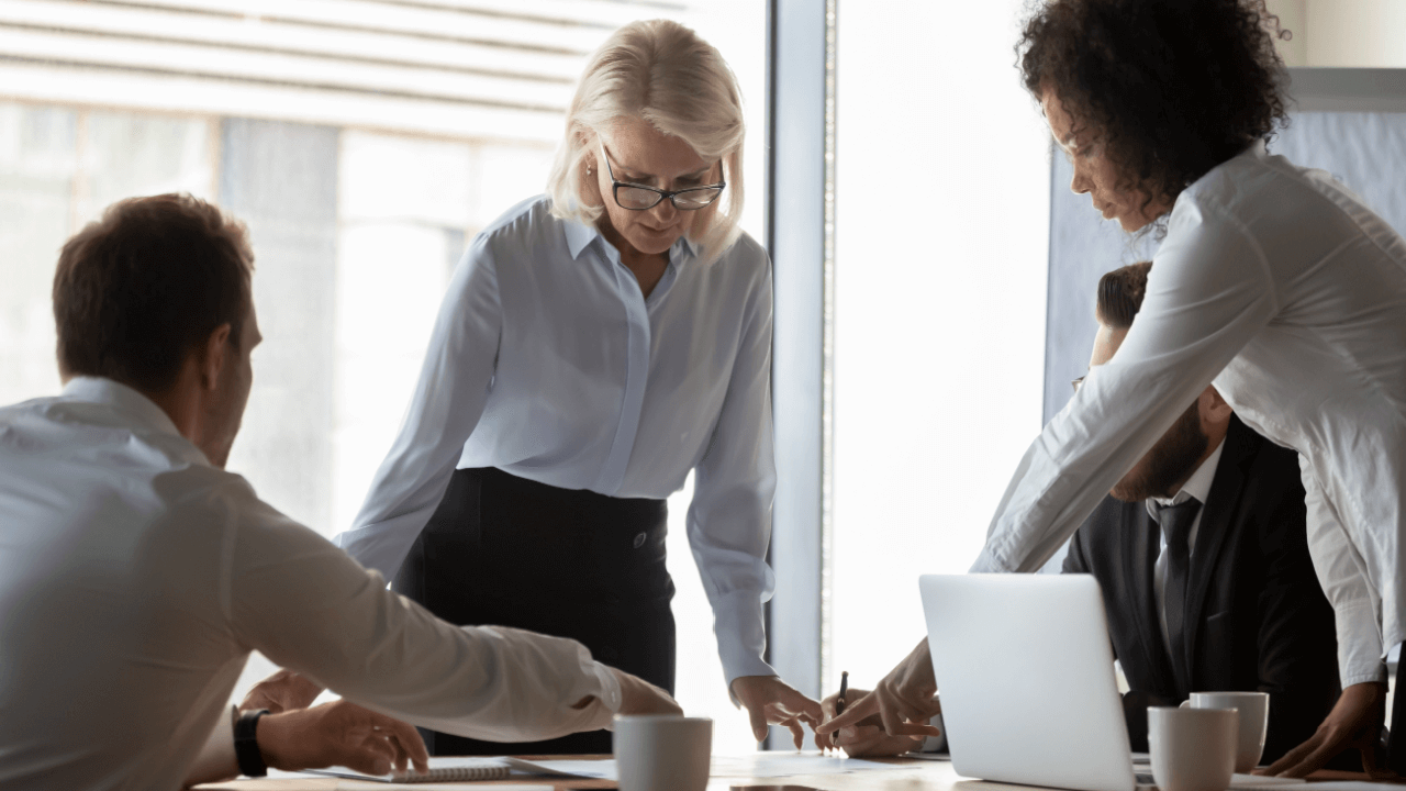 Attorneys discussing organic legal lead generation strategies during law firm marketing meeting