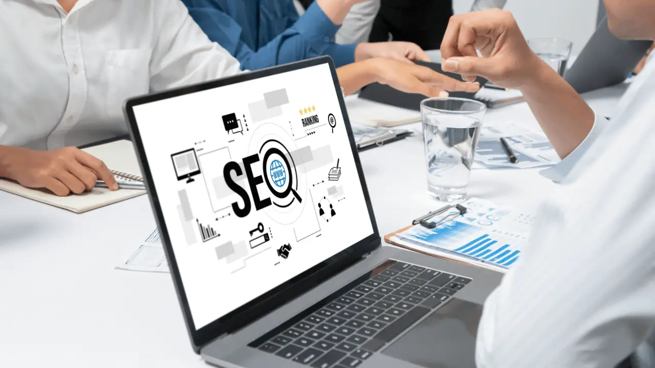 Legal SEO authority building team meeting with laptop showing SEO strategy, analytics charts, and digital marketing icons