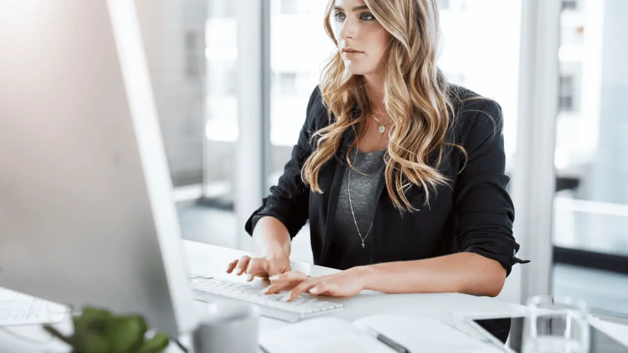 Attorney creating practice area SEO content on computer for law firm digital marketing strategy